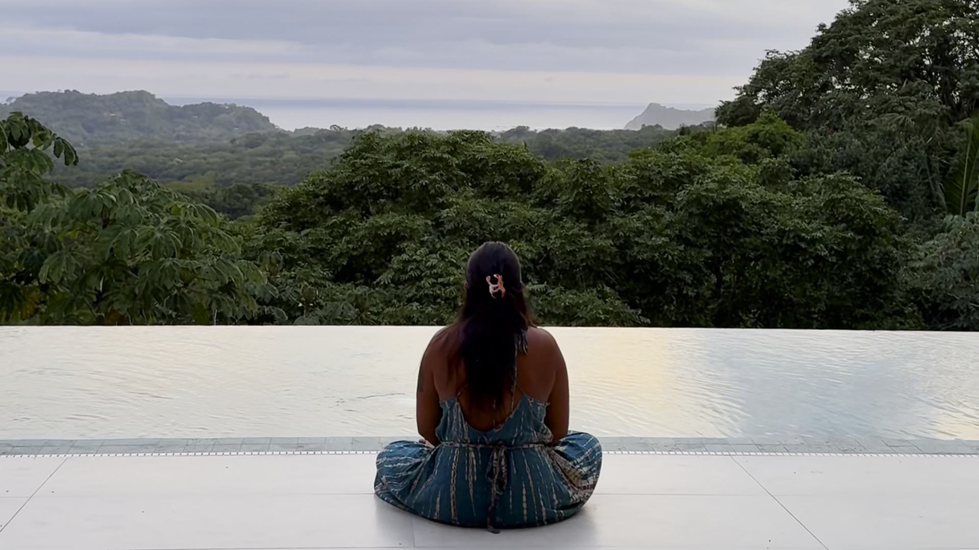 Sitting by the pool above the jungle in Costa Rica